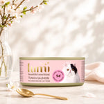 Lumi tuna and salmon cat food can on a table with a soft background
